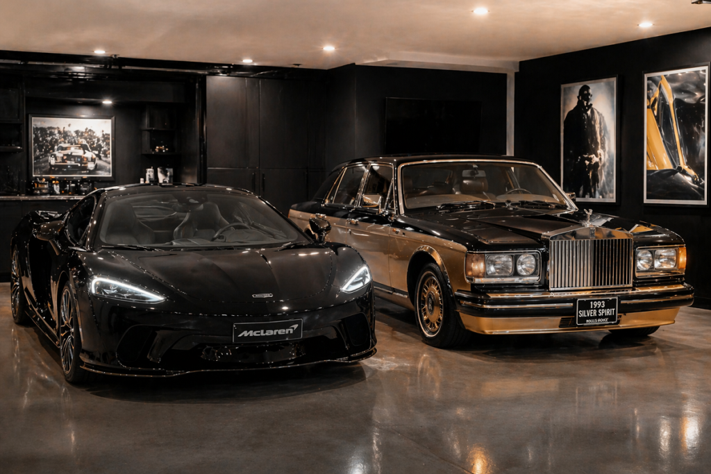 McLaren GT and Rolls-Royce Silver Spirit parked in a private luxury garage