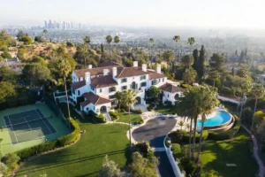 Aerial view of Beverly Hills luxury mansion estate with infinity pool