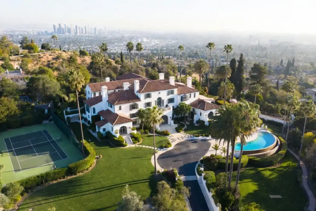 Aerial view of Beverly Hills luxury mansion estate with infinity pool