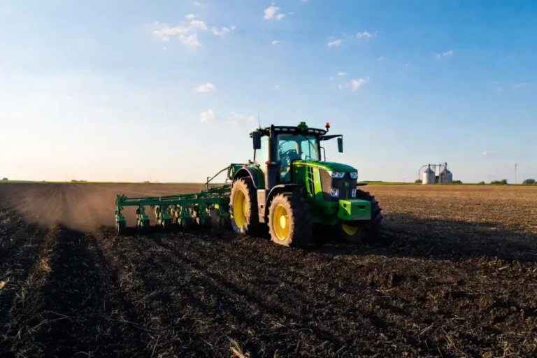 Tractor planting corn in Iowa field during May 2026 spring planting season
