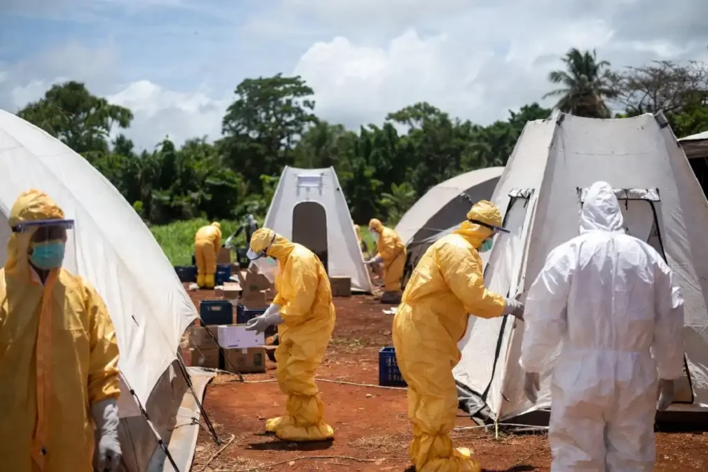 Medical team in full PPE setting up an Ebola treatment center in Ituri province DR Congo