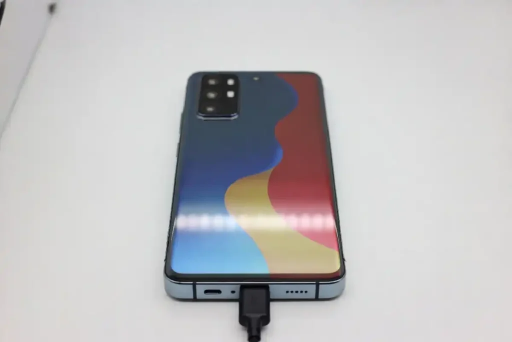 Budget Android smartphone with large display and triple rear camera on white background