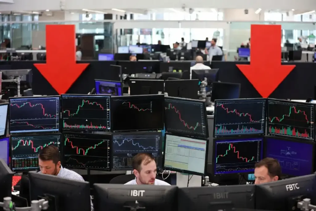 Trading floor screens showing spot Bitcoin ETF outflows in May 2026