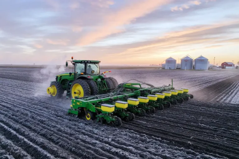 Tractor and planter seeding corn into cool spring soil during the 2026 US planting season