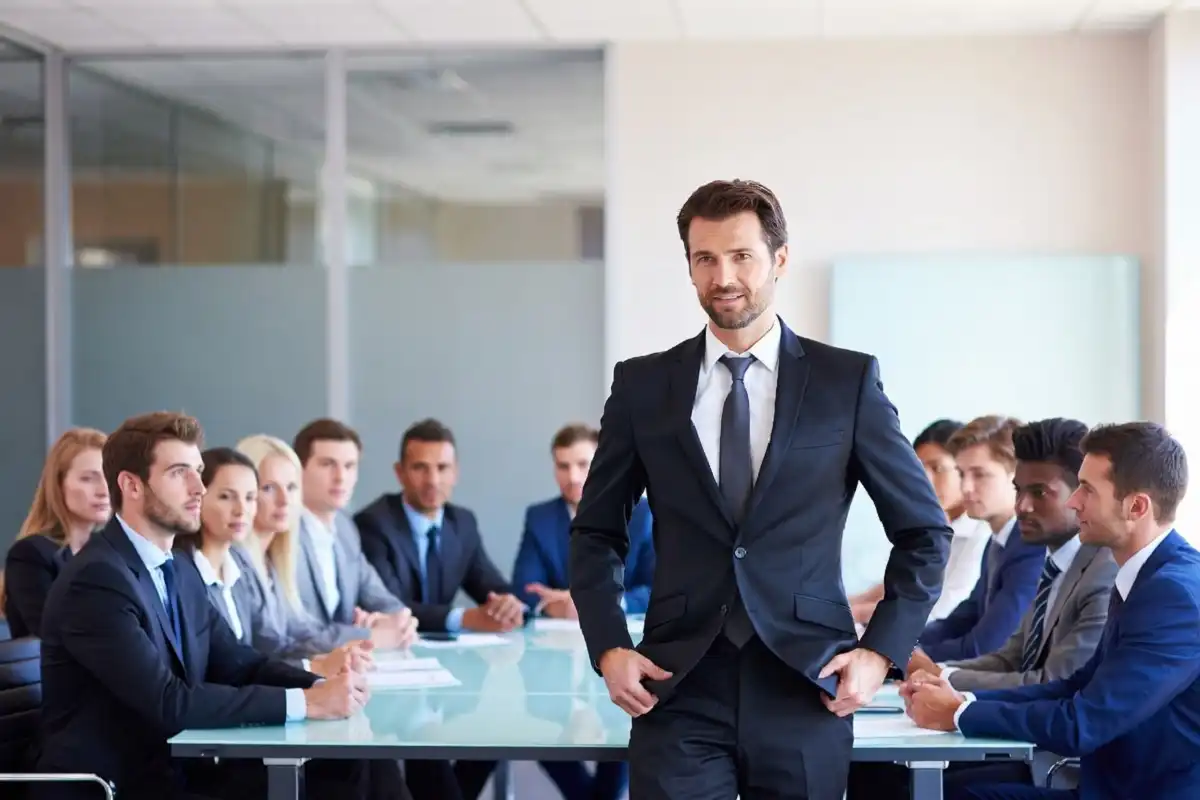 Corporate leader addressing a professional team in a modern boardroom setting