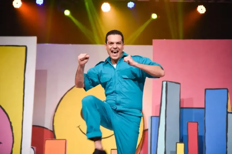 Danny Go YouTube star performing in colorful teal outfit