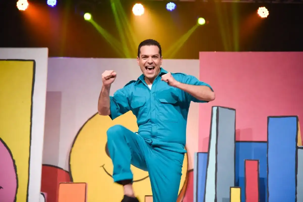 Danny Go YouTube star performing in colorful teal outfit