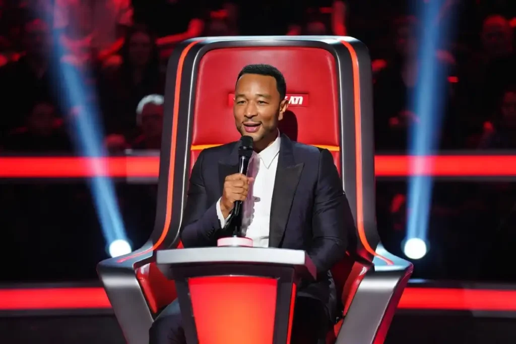 John Legend on The Voice red coaching chair