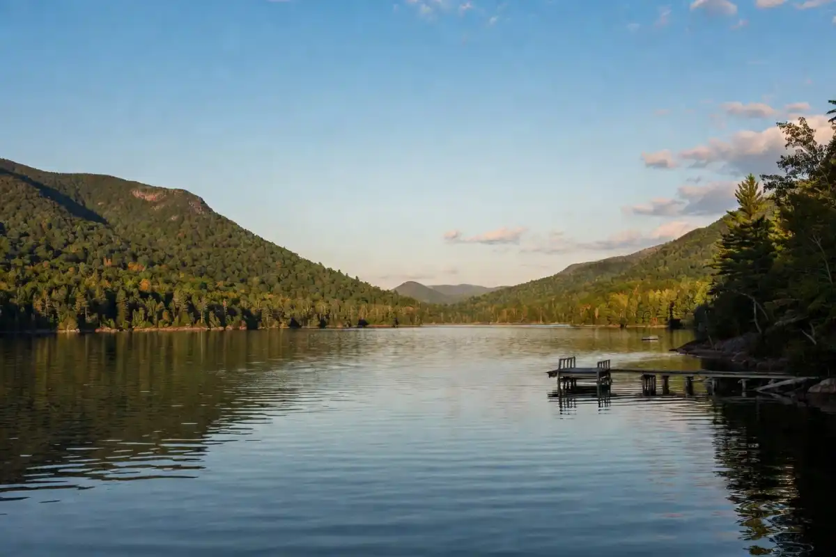 Adirondacks events 2026 scenic mountain lake and forested hillside backdrop in upstate New York